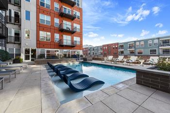Outdoor resort-style pool courtyard with year-round spa